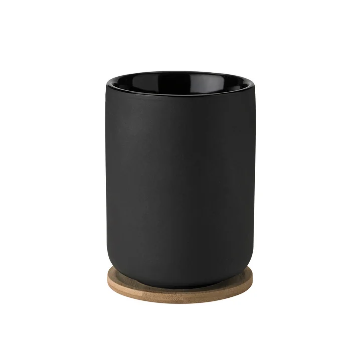 Theo Teebecher mit Untersetzer von Stelton